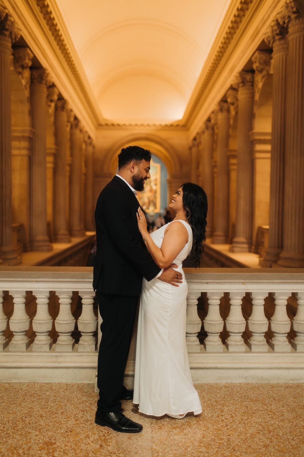 Piratheepan and Shivanna posing together inside the Metropolitan Museum of Art during their engagement shoot